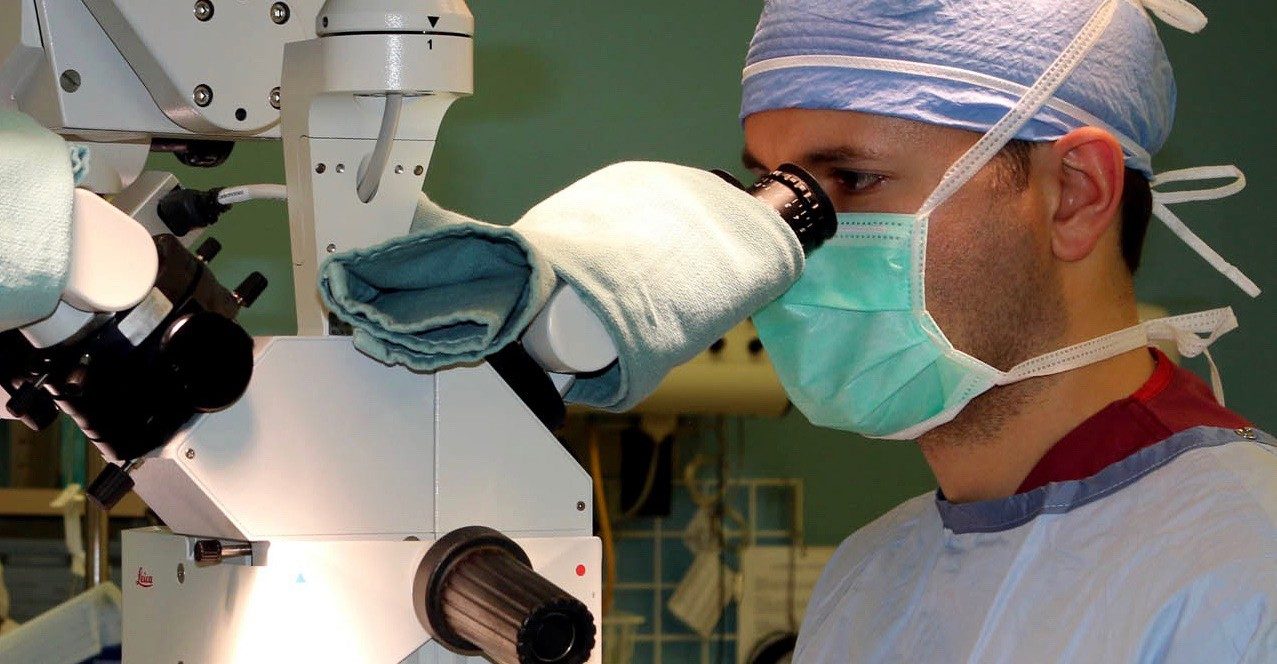Alexander Mericli, M.D., performs microsurgery on a cancer patient