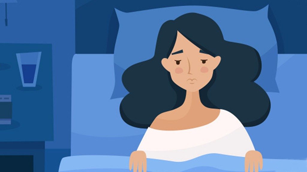 图片与蓝色背景显示疲惫的女人在床上