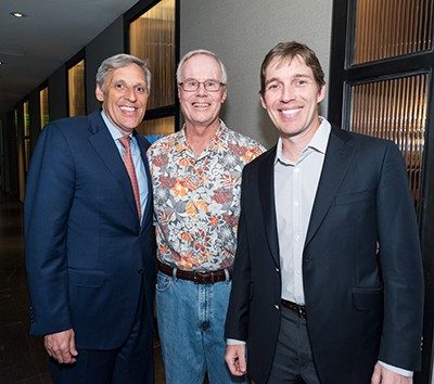 Tom Segesta, from left, Mark Rolfing and Nathan Stedham enjoy the evening at the Four Seasons' Topgolf® Swing Suite. Photo by Adolfo Chavez III